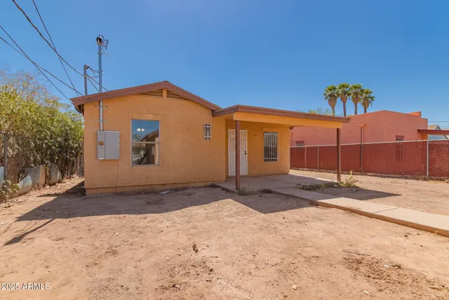 a room with a sink and a mirror
