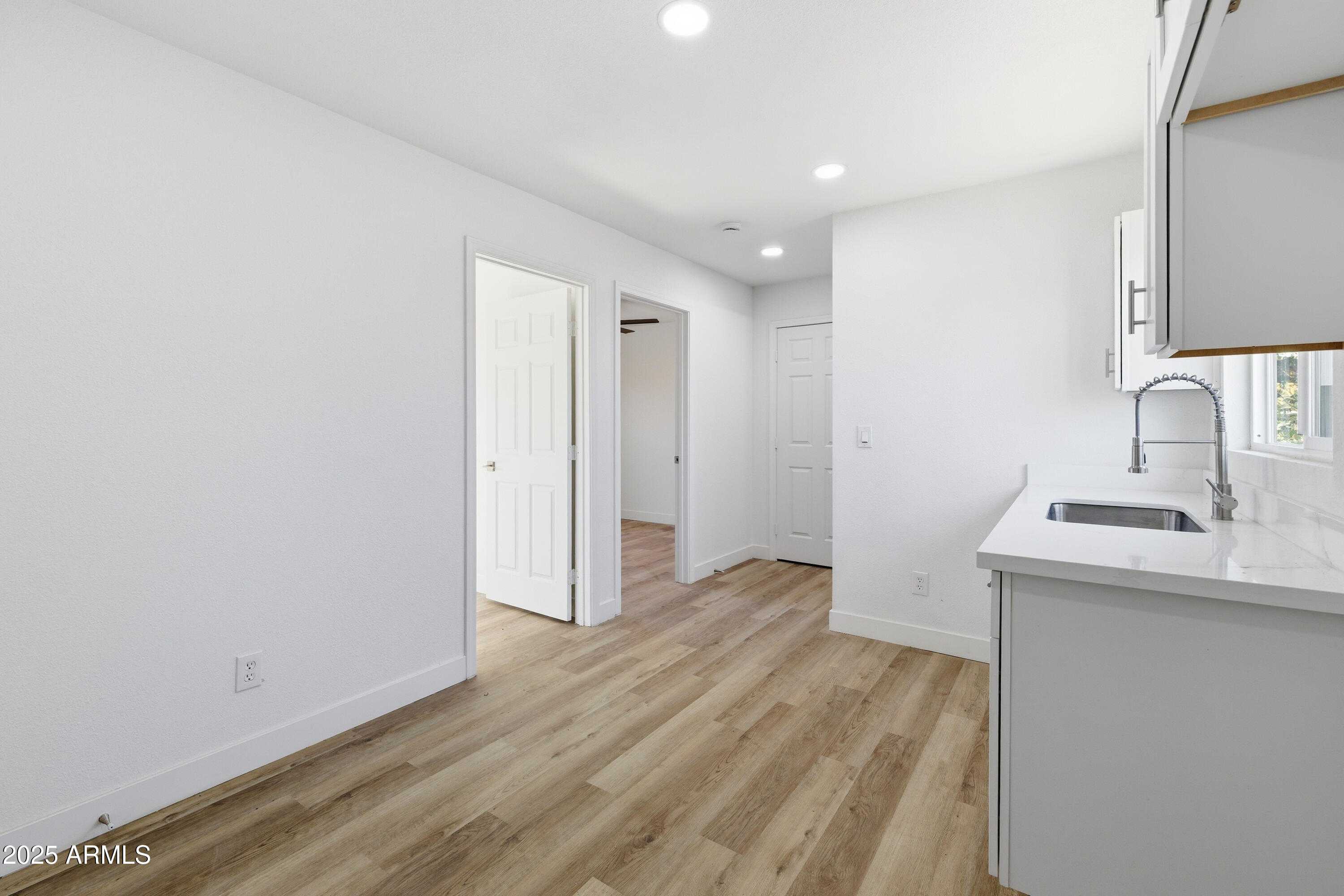 2118 West Adams Street Phoenix, AZ 85009 - Photo 28 of 48 a room with a sink and a mirror