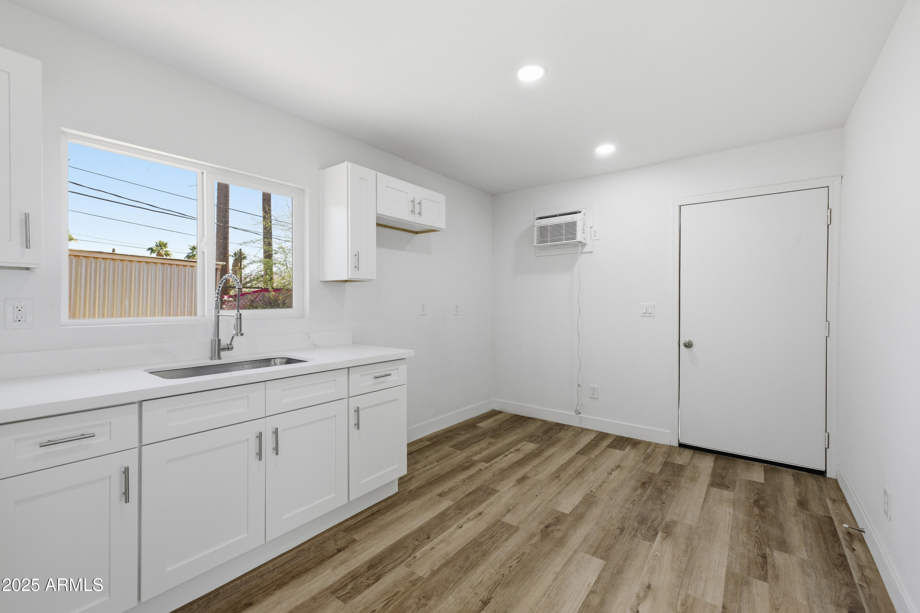 2118 West Adams Street Phoenix, AZ 85009 - Photo 30 of 48 a bathroom with a sink and a mirror