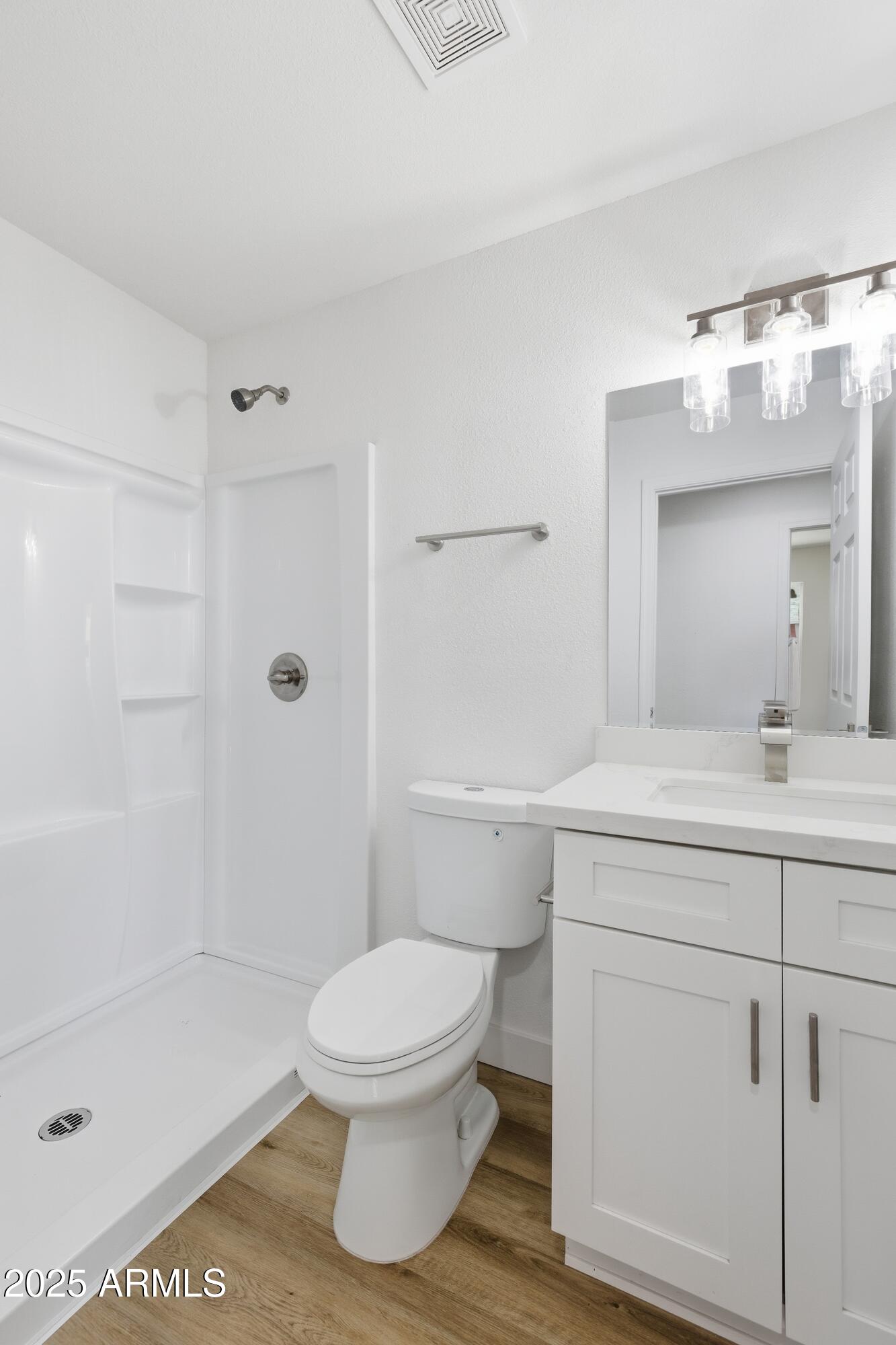 2118 West Adams Street Phoenix, AZ 85009 - Photo 35 of 48 a bathroom with a sink a toilet and shower