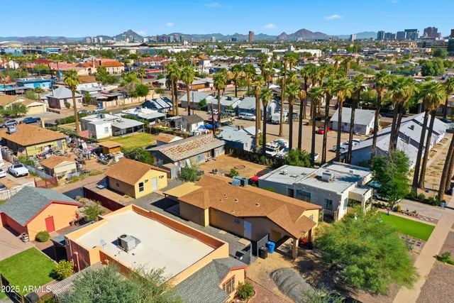 an aerial view of a houses with a outdoor space