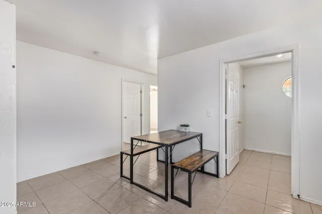 a kitchen with a sink window and cabinets