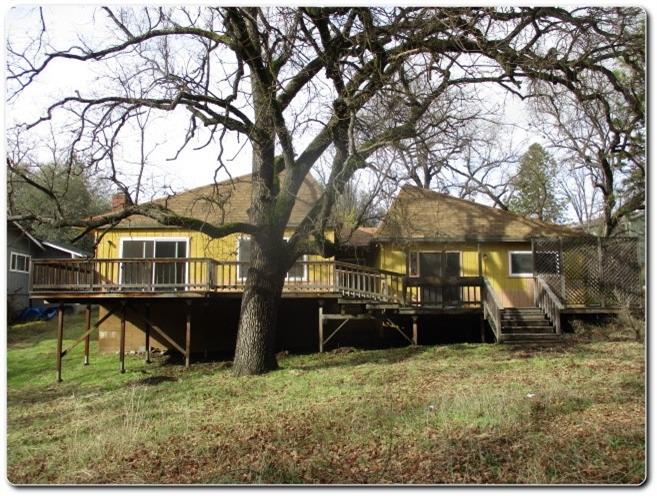 40367 Redbud Drive Oakhurst, CA 93644 - Photo 13 of 15 a view of a house with a yard