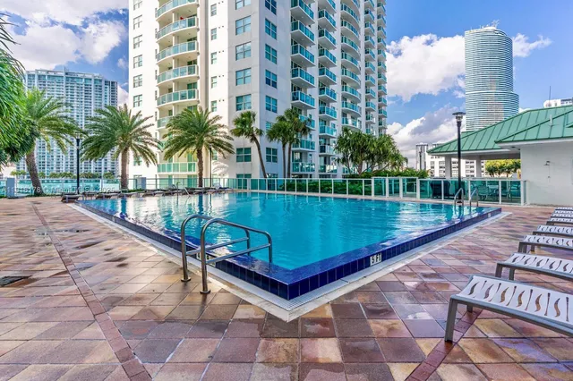a view of a swimming pool with a patio