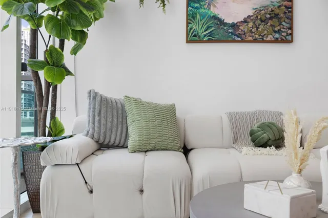 a bedroom with a bed potted plant and a window