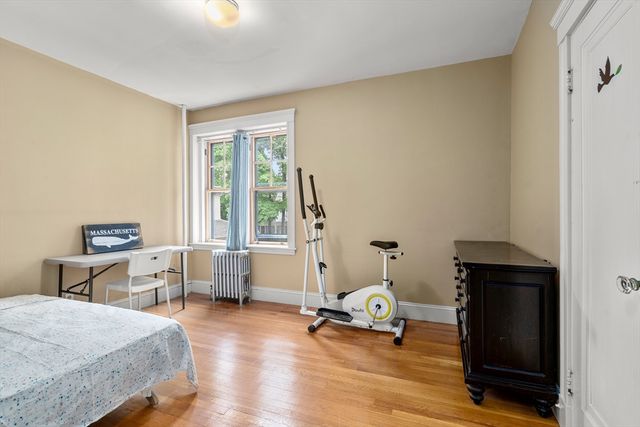 a bedroom with furniture and a window