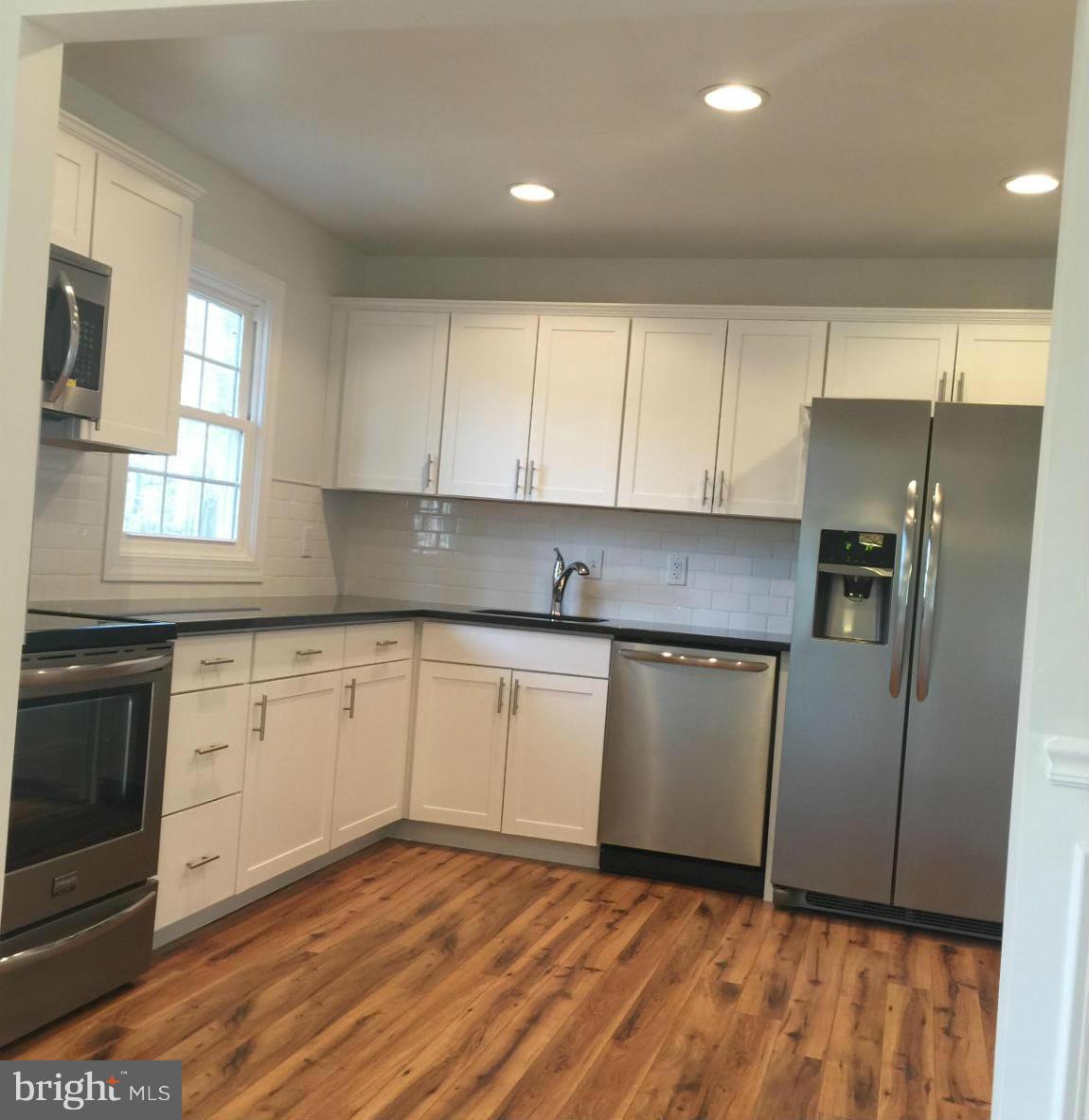 13533 Delaney Road Woodbridge, VA 22193 - Photo 9 of 21 RECESSED LIGHTING KITCHEN W/ BACK SPLASH
