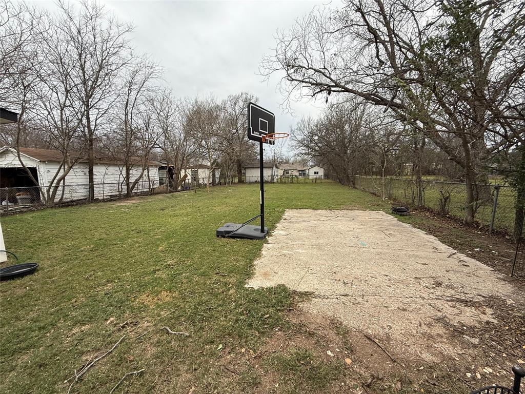 124 Cedar Street Waco, TX 76705 - Photo 11 of 12 a view of a backyard with a garden and entertaining space