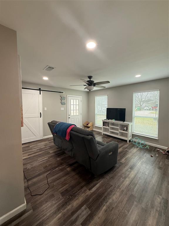 124 Cedar Street Waco, TX 76705 - Photo 2 of 12 a living room with furniture and a flat screen tv