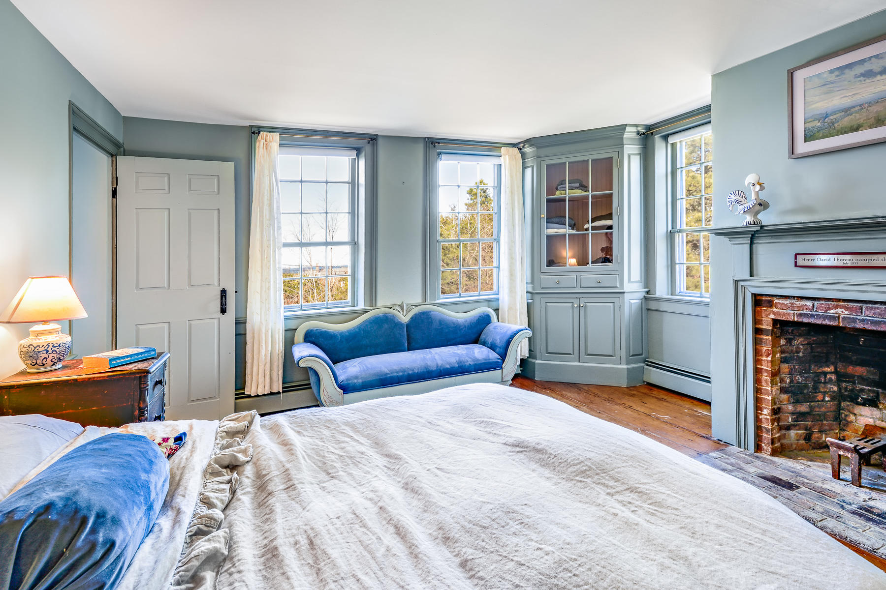 24 Old County Road Truro, MA 02666 - Photo 22 of 42 a bedroom with a bed and a fireplace