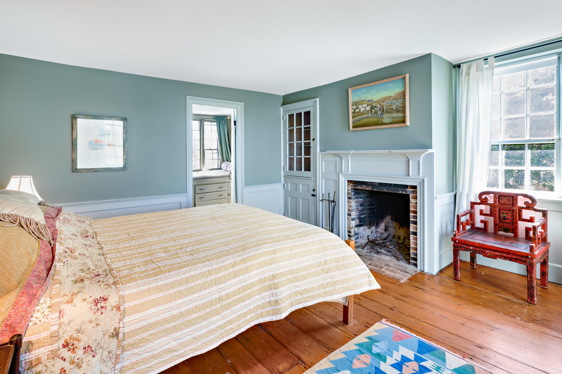 24 Old County Road Truro, MA 02666 - Photo 26 of 42 a bedroom with a bed and a fireplace