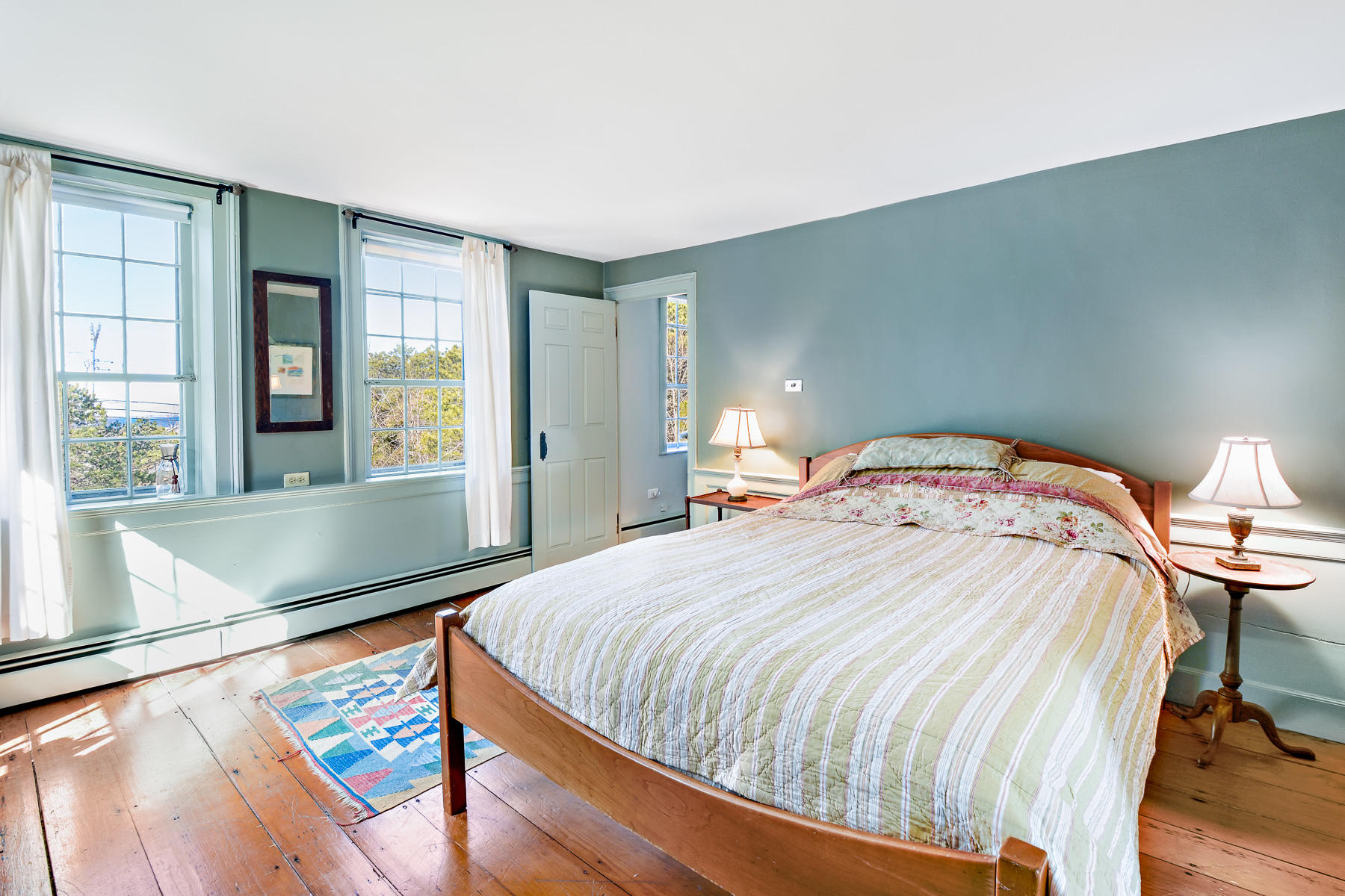 24 Old County Road Truro, MA 02666 - Photo 27 of 42 a bedroom with a bed and a large window with outer view
