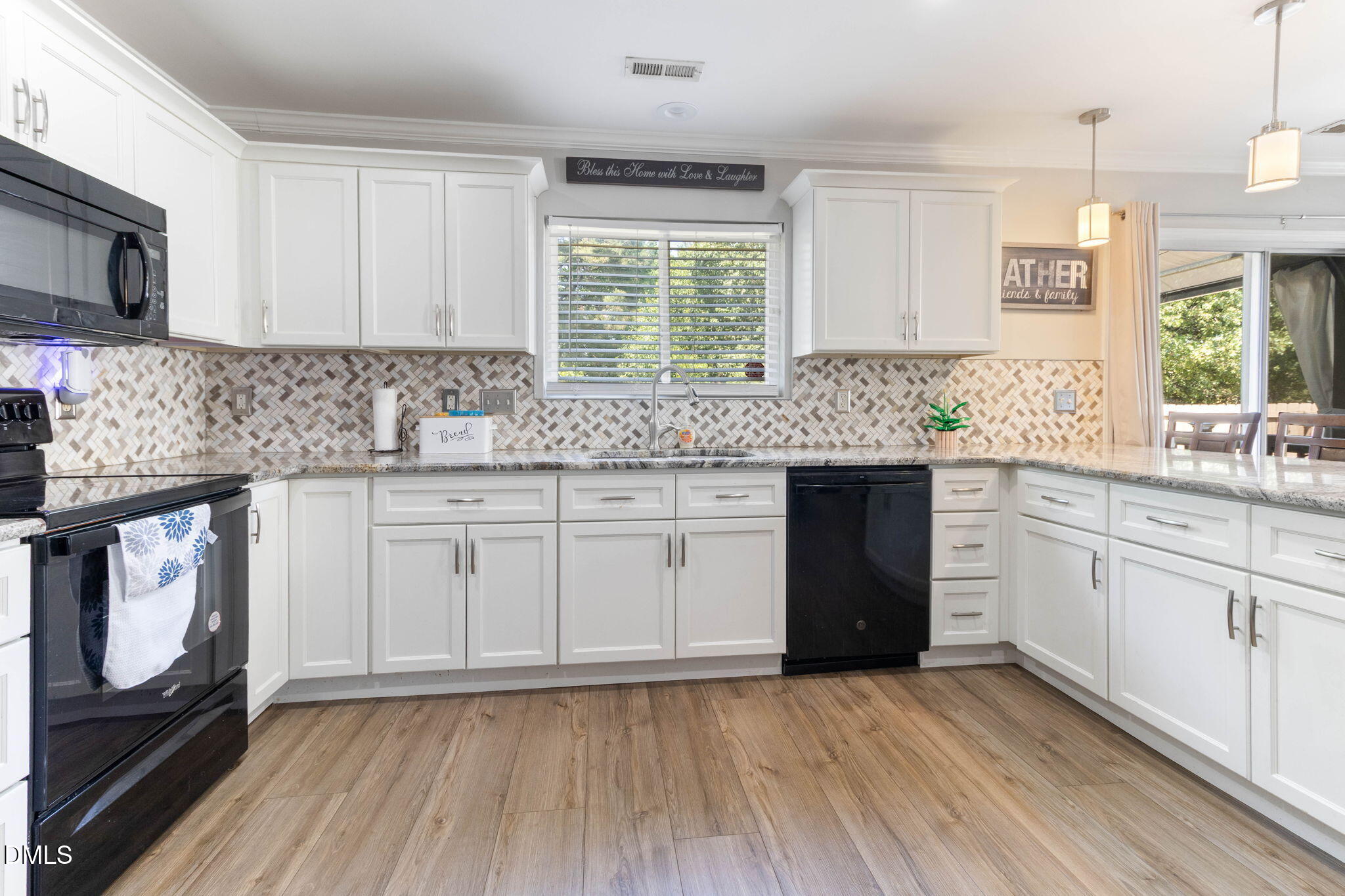 3713 Marshlane Way Raleigh, NC 27610 - Photo 12 of 38 a kitchen with a sink stove and cabinets