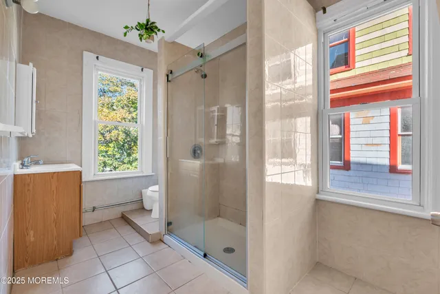 a bathroom with a shower and a toilet