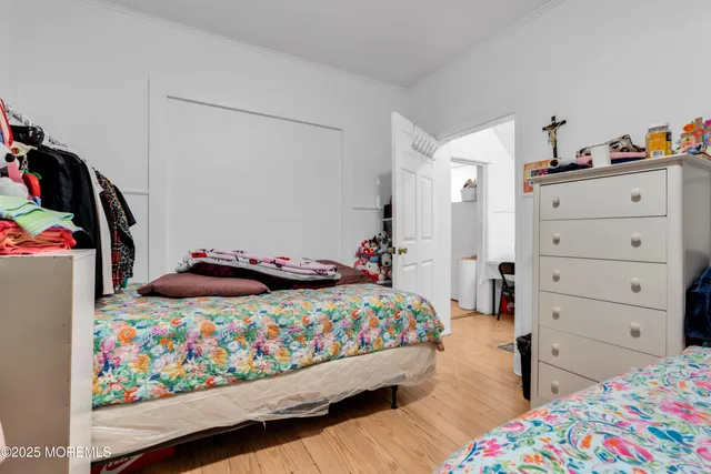 a bedroom with a bed and closet