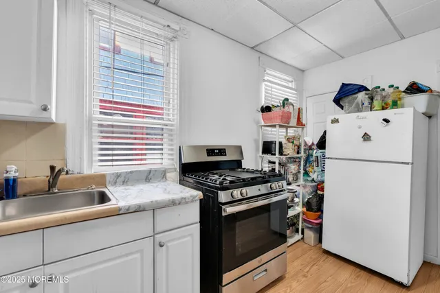 a bathroom with a sink toilet and mirror