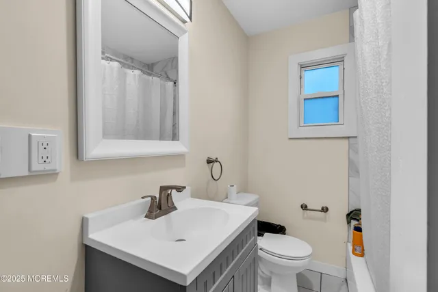 a view of a patio with table and chairs with wooden floor and fence