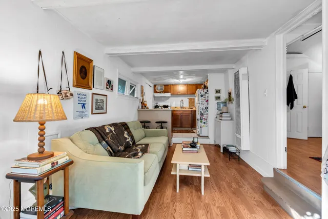 a kitchen with stainless steel appliances granite countertop a sink and a refrigerator