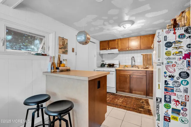 a view of a chairs and table in a patio