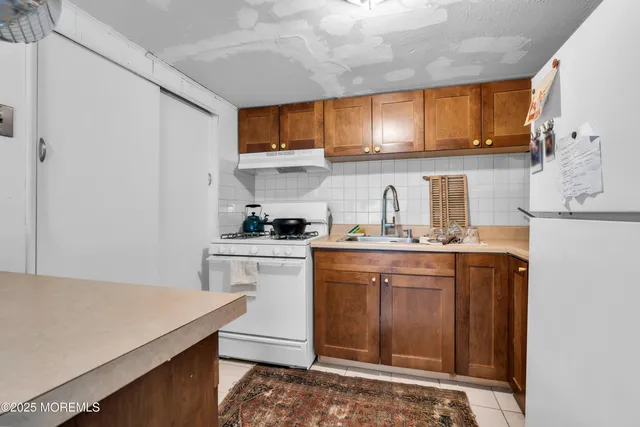 a bedroom with a bed and a desk