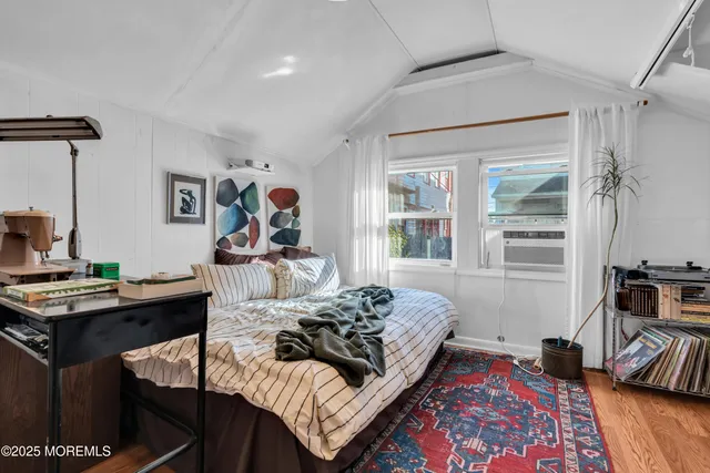 a living room with furniture and a mirror