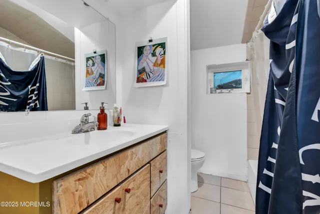 a view of a building with wooden fence