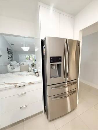 a kitchen with appliances and cabinets