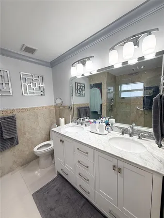 a bathroom with a glass door shower