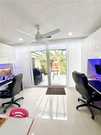 a workspace with furniture and a gate