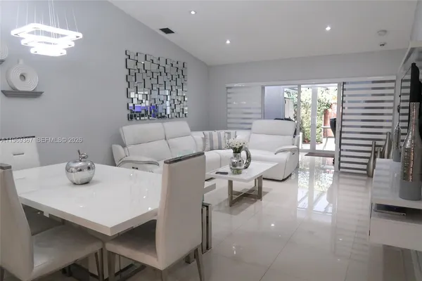 a living room with furniture and a table