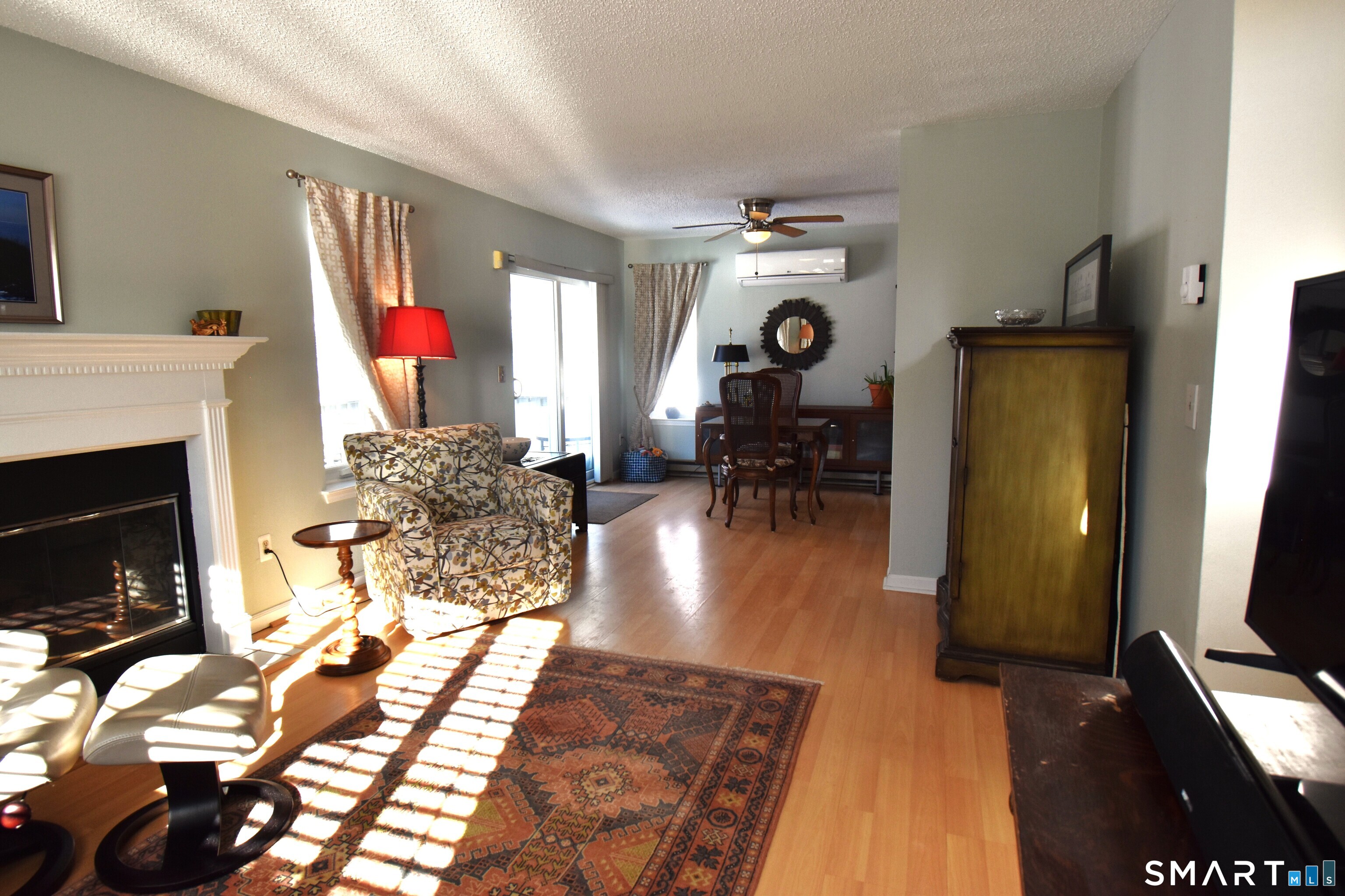 925 Oronoke Road, Unit 38A Waterbury, CT 06708 - Photo 10 of 29 a living room with furniture a flat screen tv and a fireplace