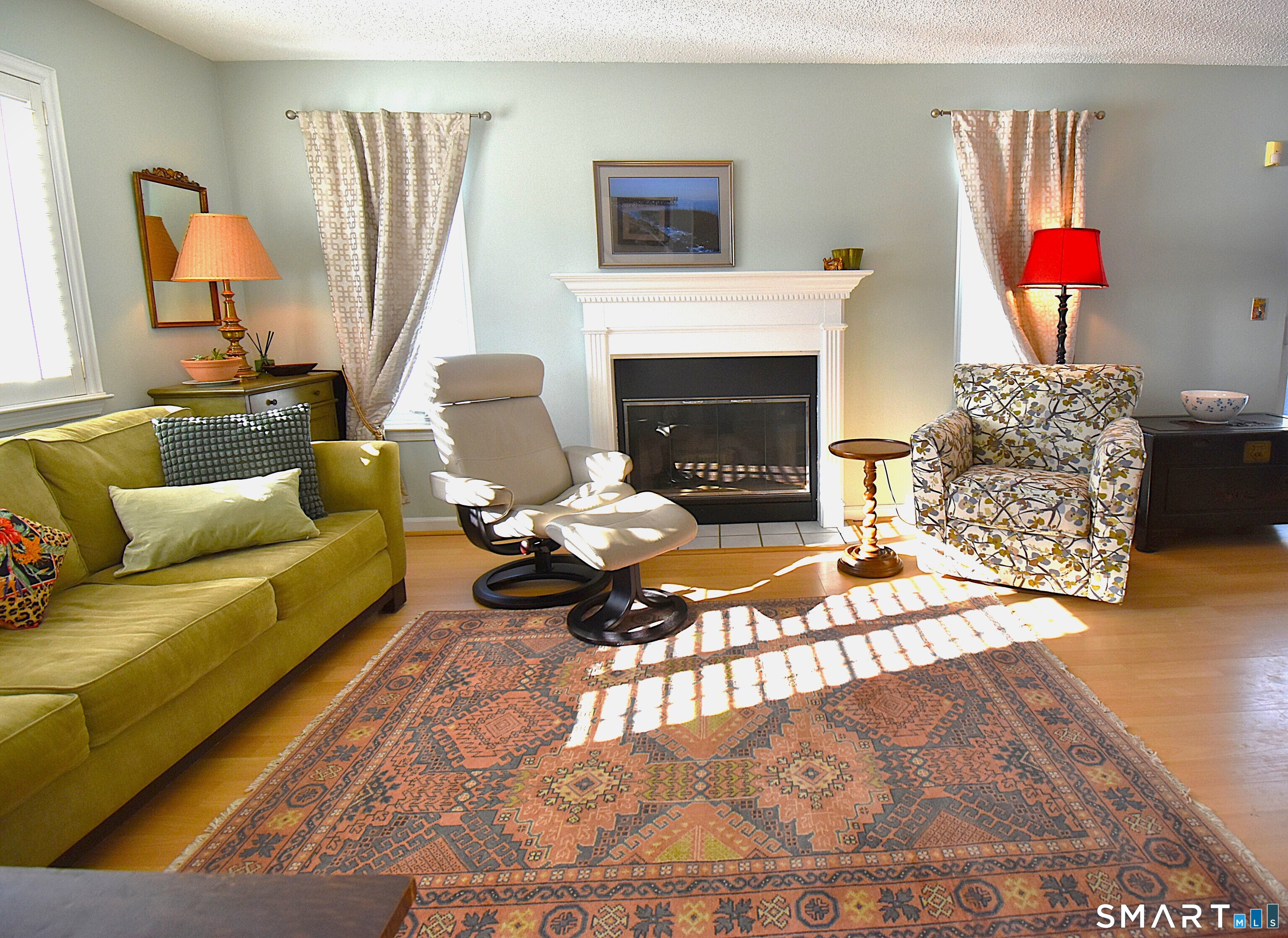 925 Oronoke Road, Unit 38A Waterbury, CT 06708 - Photo 13 of 29 a living room with furniture a rug and a fireplace