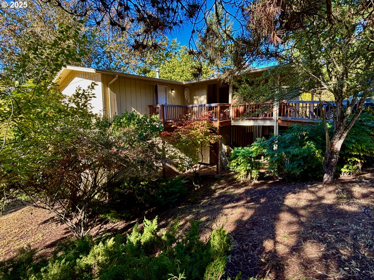 3790 Onyx Street Eugene, OR 97405 - Photo 1 of 13 a backyard of a house with lots of green space