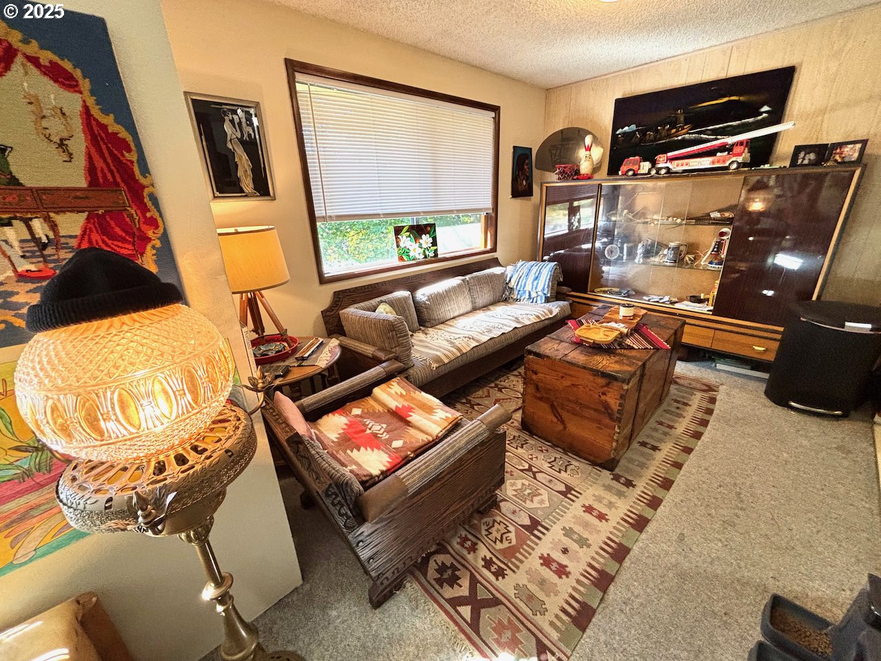 3790 Onyx Street Eugene, OR 97405 - Photo 5 of 13 a living room with furniture and a flat screen tv