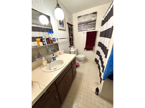 a bed room with a bed furniture and a flat screen tv
