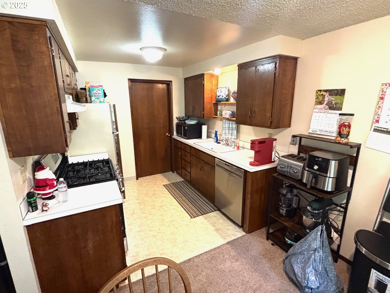 3790 Onyx Street Eugene, OR 97405 - Photo 9 of 13 a bed room with a bed furniture and a flat screen tv