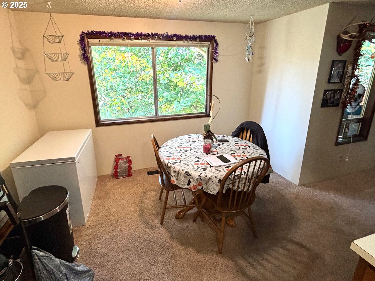 3790 Onyx Street Eugene, OR 97405 - Photo 10 of 13 a view of a dining room with furniture and a fireplace