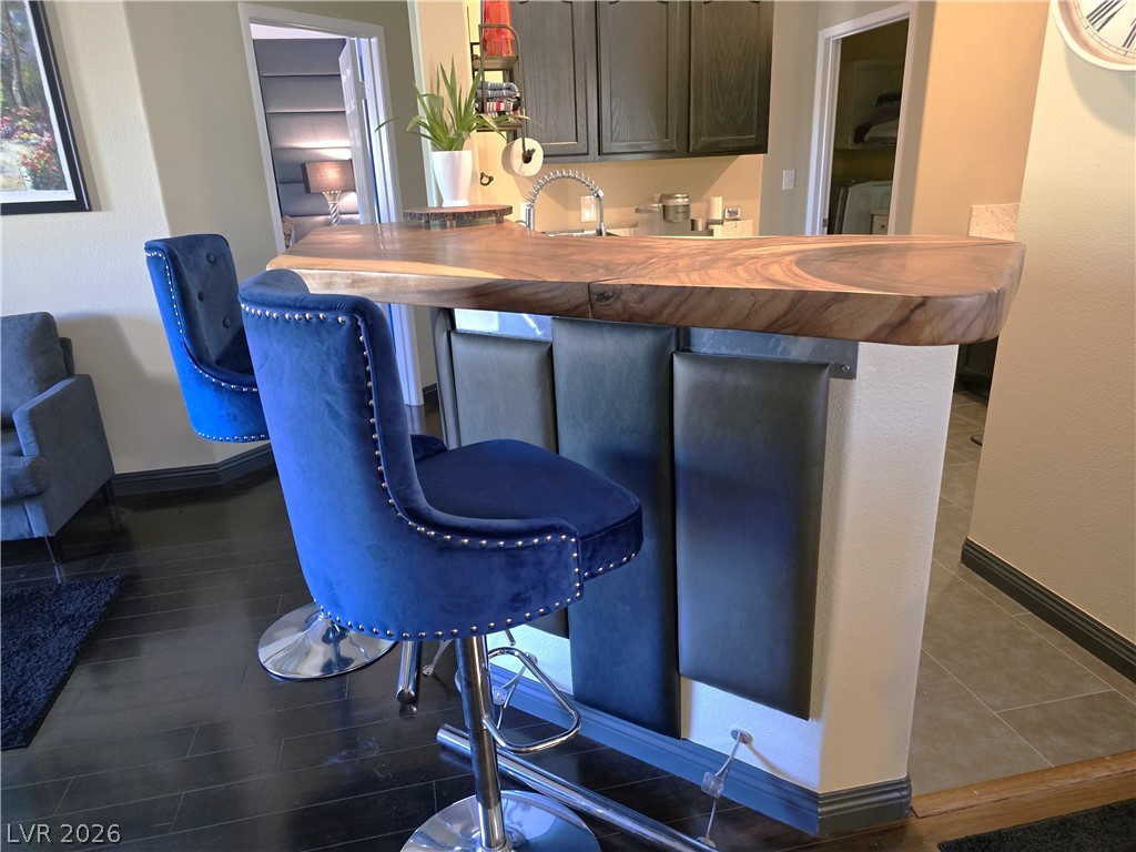 2050 West Warm Springs Road, Unit 2422 Henderson, NV 89014 - Photo 9 of 44 This sleek bar area features rich wood and contemporary design, perfect for entertaining.