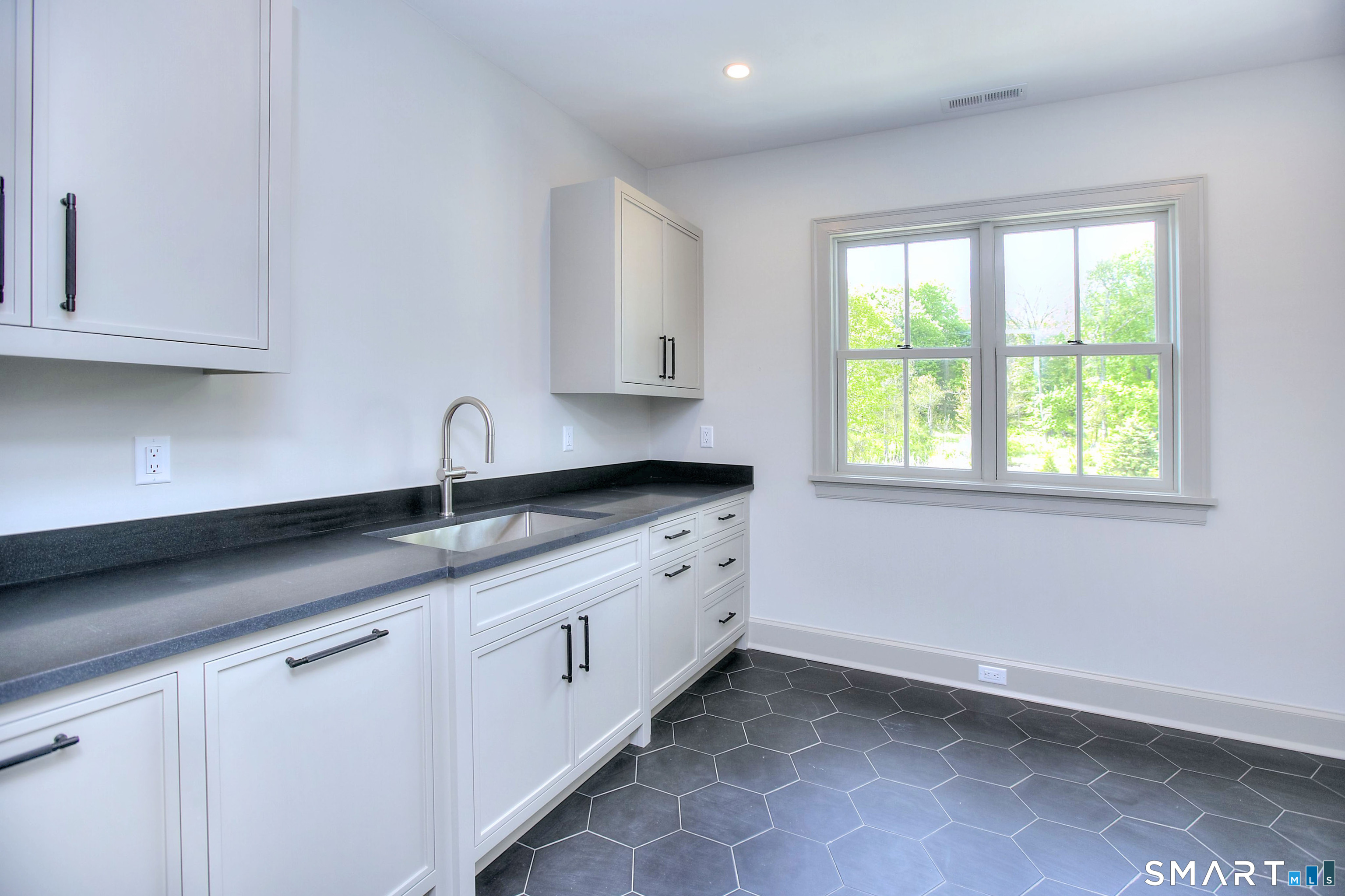 48 Kettle Creek Road Weston, CT 06883 - Photo 31 of 40 a kitchen with a sink and cabinets