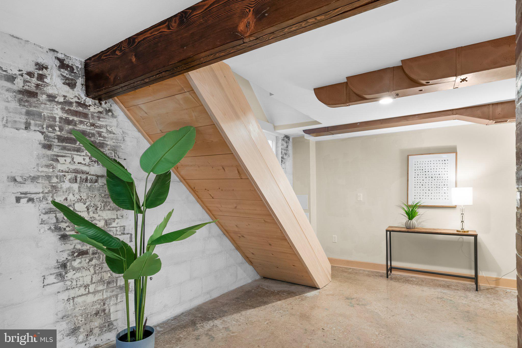 218 St Lawrence Drive Silver Spring, MD 20901 - Photo 35 of 63 Exposed brick and polished concrete floors