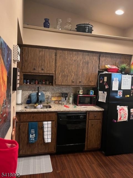 14 Crossway Clinton, NJ 08809 - Photo 6 of 6 a kitchen with stainless steel appliances granite countertop a stove a sink dishwasher and cabinets with wooden floor