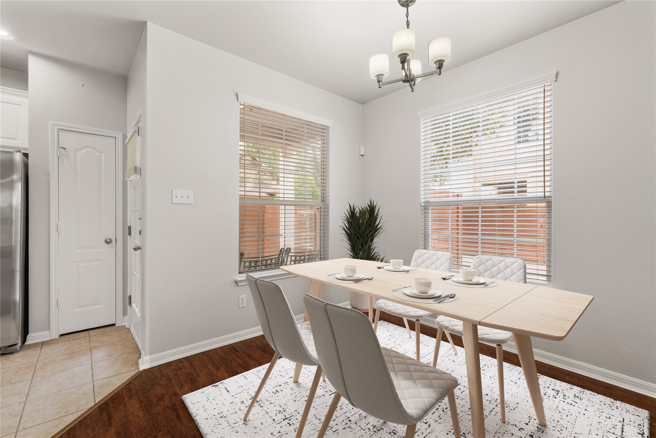 11000 Anderson Mill Road, Unit 45 Austin, TX 78750 - Photo 11 of 32 a view of a dining room with furniture window and wooden floor