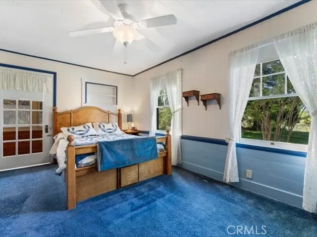 a bathroom with a shower curtain and a sink