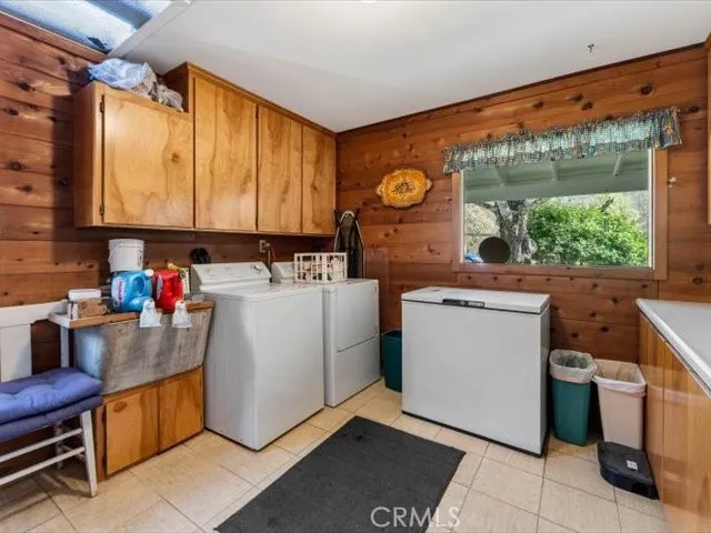 a living room with patio furniture and a flat screen tv