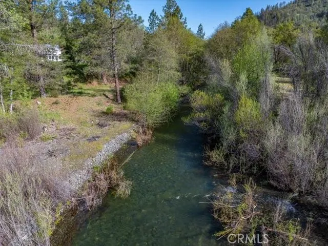 a view of a yard with a house in the background