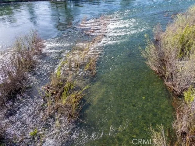 a view of a balcony with wooden floor and outdoor seating