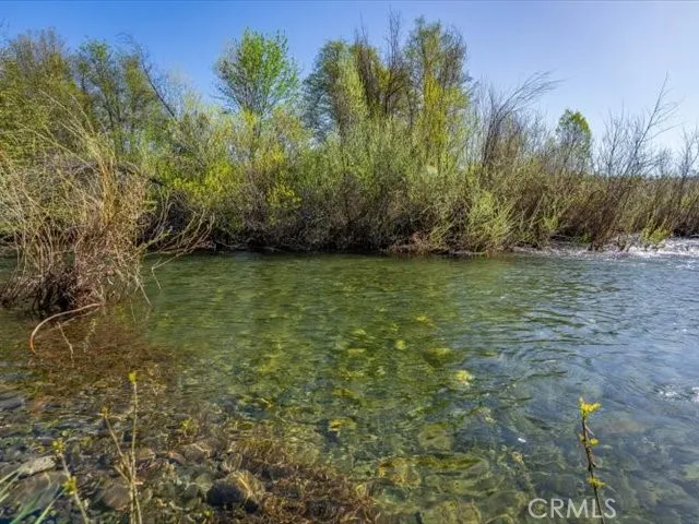a view of a lake with a yard
