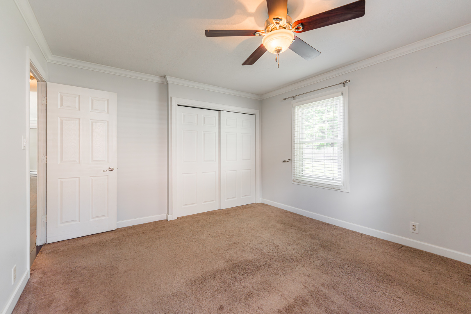 1614 East Dresser Road DeKalb, IL 60115 - Photo 13 of 26 a view of an empty room with a window