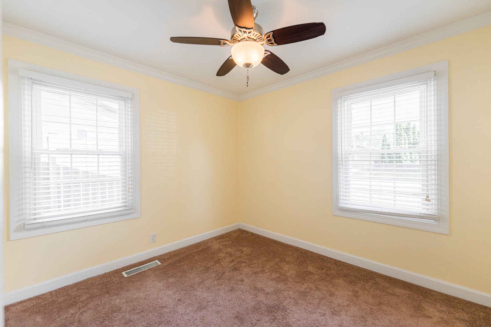 1614 East Dresser Road DeKalb, IL 60115 - Photo 14 of 26 an empty room with a window and a fan
