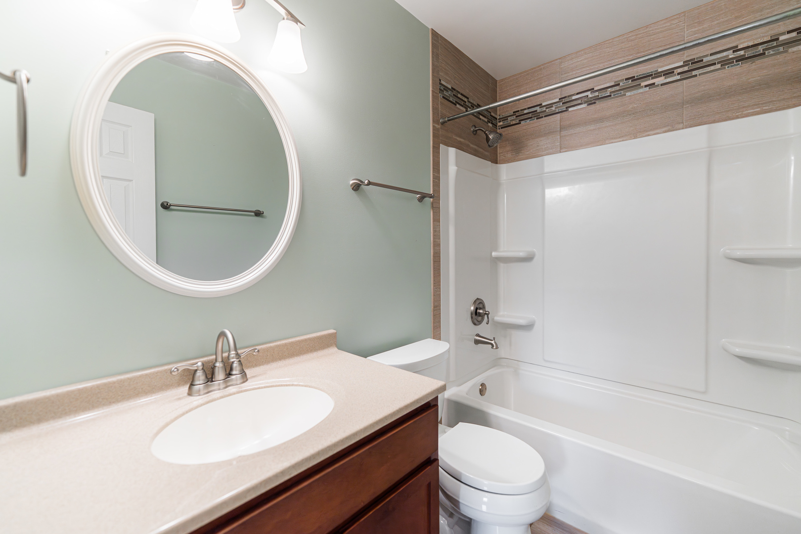1614 East Dresser Road DeKalb, IL 60115 - Photo 19 of 26 a bathroom with a granite countertop sink toilet and shower